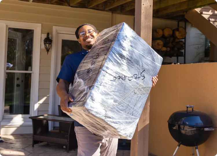 Man moving boxes from truck